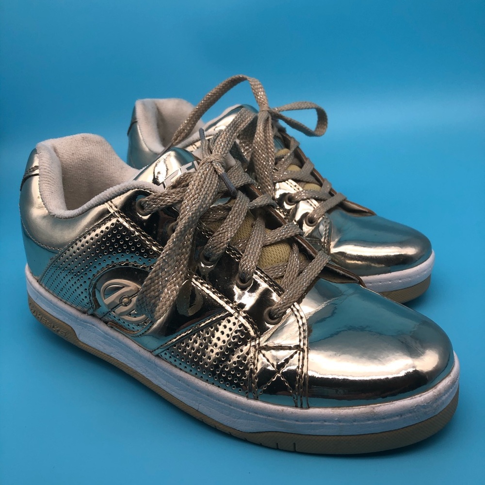 Gold woman’s heelys. Low top sneakers